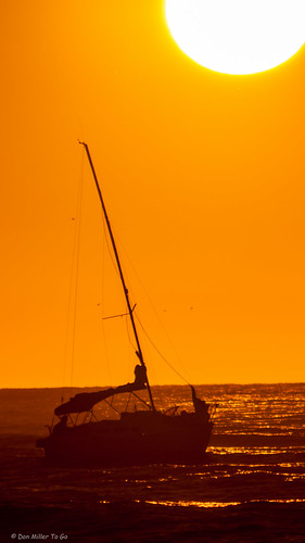 orange sun gulfofmexico catchycolors boats florida jetty silhouettes sunsets fav20 boating fav15 gf1 fav10 fav5 views500 views100 views200 views400 views300 cloudsstormssunsetssunrises sunsetsniper