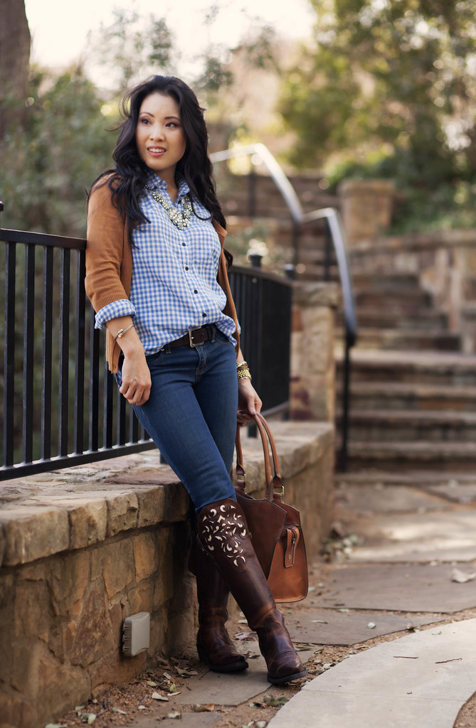 cute & little blog | equestrian chic | tan cardigan, blue gingham shirt, skinny jeans, ariat hacienda equestrian over-the-knee boots, statement necklace outfit