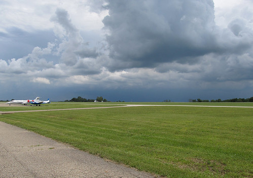 ohio summer storm weather clouds plane airplane landscape landscapes airport ramp cloudy parking airplanes stormy planes oh thunderstorm summertime parked airports storms mountvernon thunderclouds severe severeweather cumulonimbus tstorm knoxcounty learjet60 knoxcountyairport countyairport n260aj 4i3 b50twinbonanza n695pv