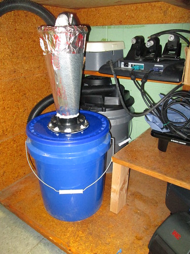 Vacuum and cyclone separator tucked away in the under-bench cabinet.