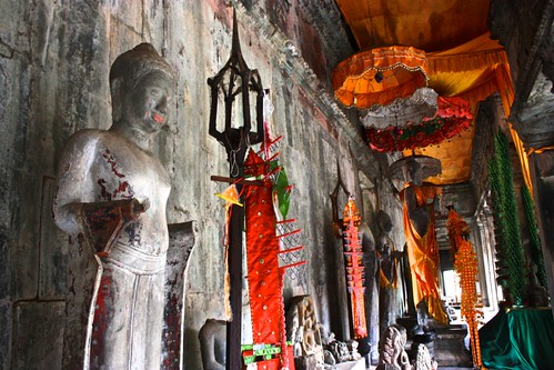 adorned Buddhas in the cooridors of Angkor Wat