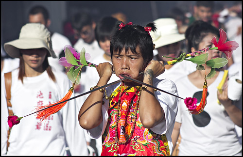 Female Ma Song with face piercing in Phuket Town, Phuket Vegetarian Festival