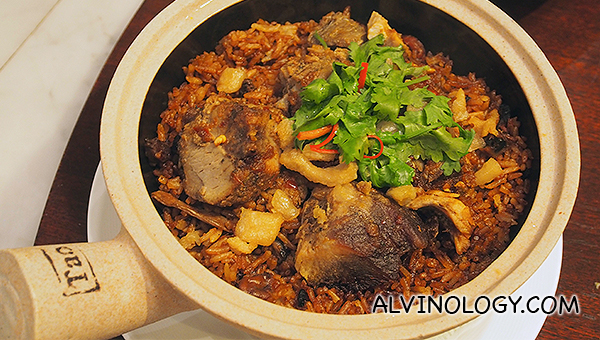 Claypot Rice with Five Spice Pork (S$23.90) - Claypot rice cooked with salted fish, goose liver sausage and Chinese sausage, dressed with lard, sesame oil and soy sauce, topped with your choice of duck char siew or five spice pork. 
