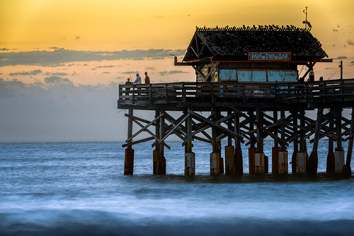 blue candid centralflorida cloud cocoa dawn florida group landscape ocean peoplephotography reflection sky sunrise usa water weather yellow dock pier cloudy day edrosackcom