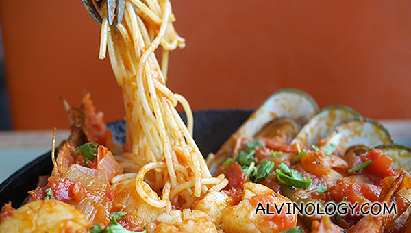 Spaghetti underneath all the seafood goodness 