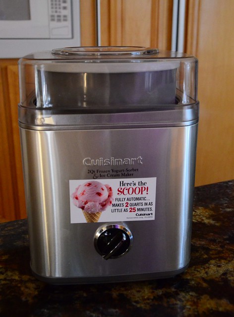 A Cuisinart ice cream maker sitting on a counter top.