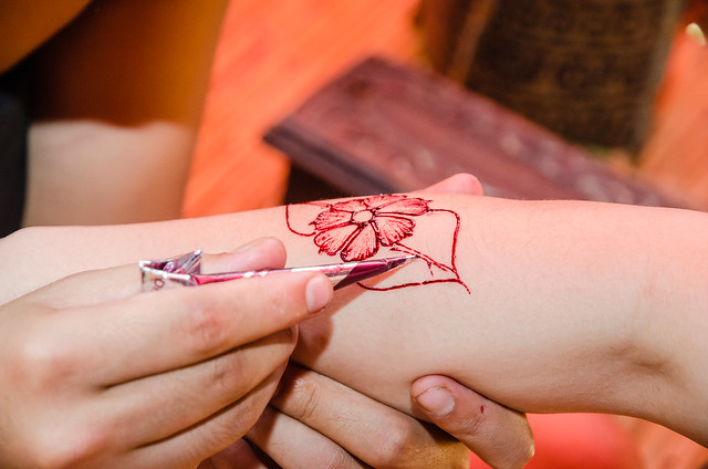A hibiscus tattoo on the hand