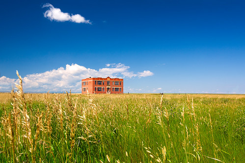 old school summer building brick abandoned field grass architecture rural america countryside buffalo montana closed mt decay country depression prairie schoolhouse decline smalltown decaying grassy easternmontana greatplains shuttered