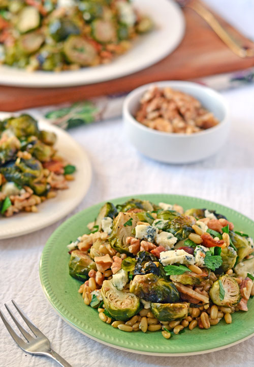 Warm Brussels sprouts salad on three plates