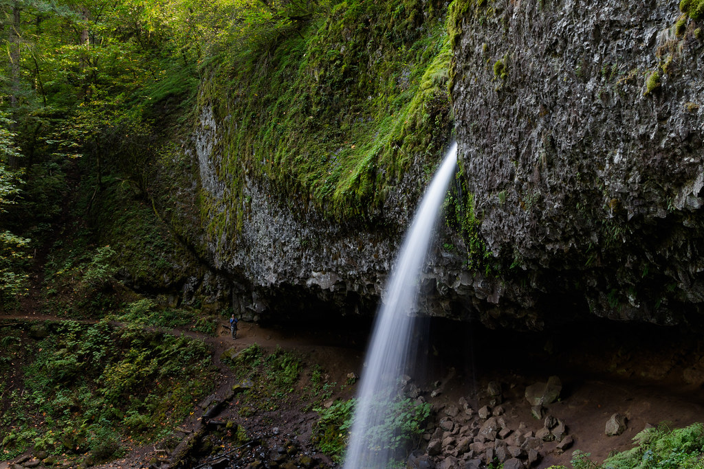 A man stands in reverence next to Upper Horsetail Falls in the Columbia River Gorge