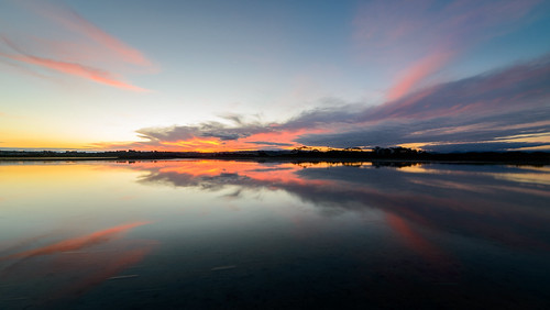 light sunset newzealand sky reflection water clouds dusk tide napier hawkesbay