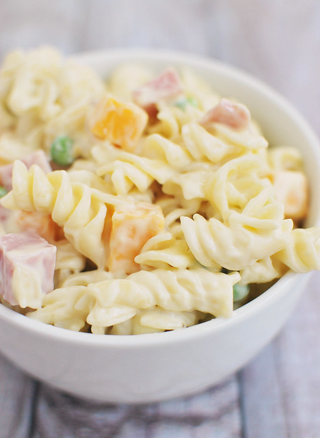 Macaroni Salad - pasta, cheddar cheese, diced ham, and peas in a creamy dressing. A classic side dish that is always a hit!