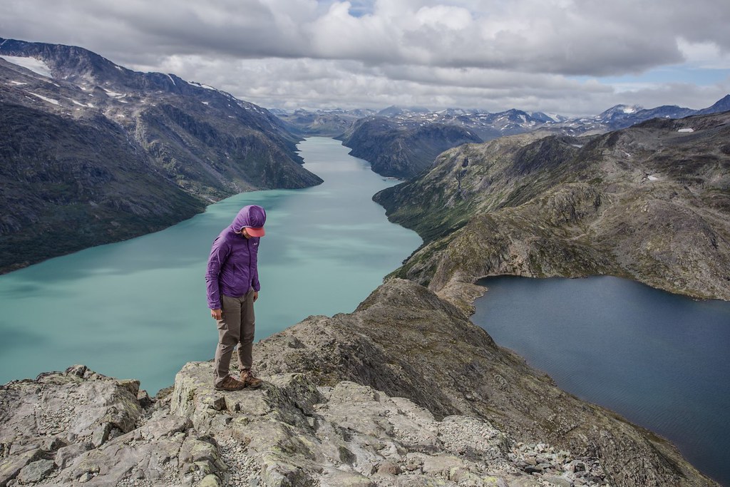 The walk over Besseggen ridge is one of the most popular mountain hikes in Norway. About 30,000 people walk this trip each year. From Besseggen there is a great view over azure Gjende (glacial) and dark Bessvatnet lake. Jotunheimen NP. Norway.