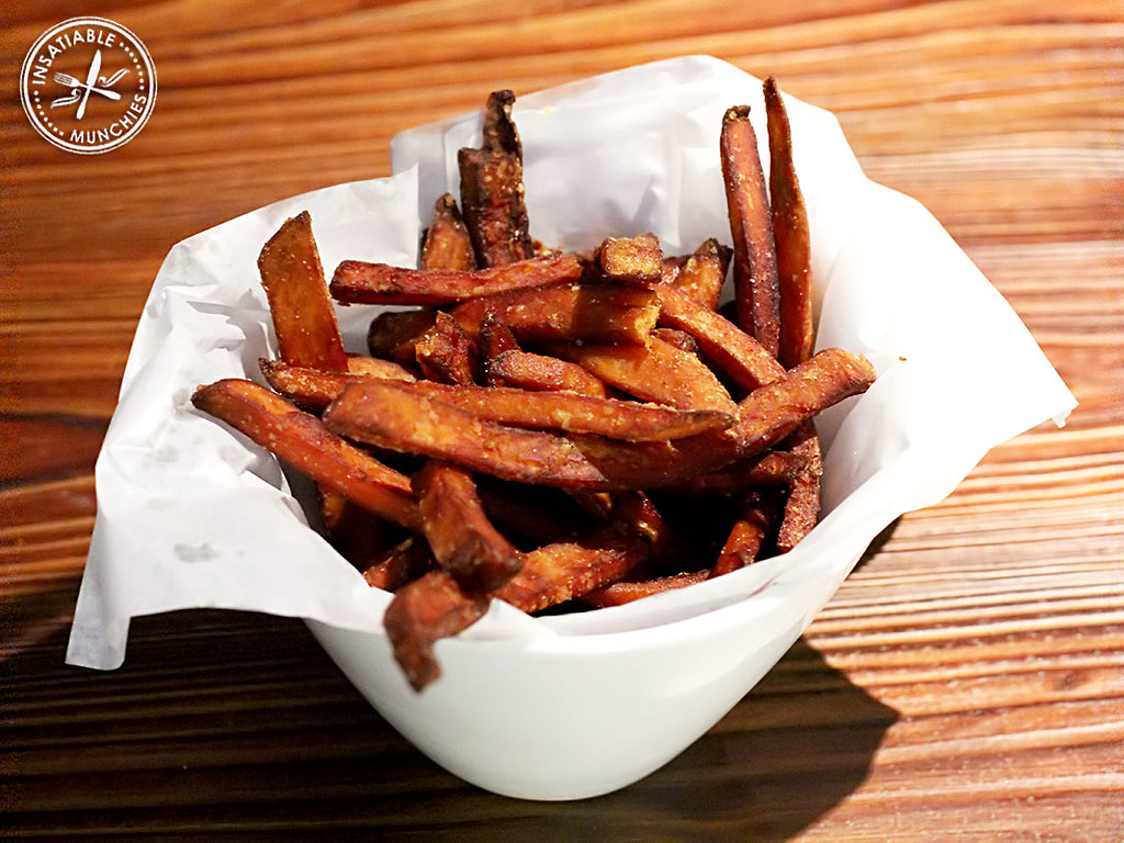 Sweet potato shoe string fries are simply topped with truffle oil, to create a rich, moreish, yet simple bite. 