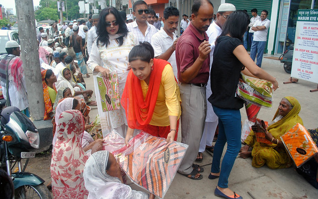 BJP Minority Morcha members distribute clothes among poor Muslims in Guwahati.