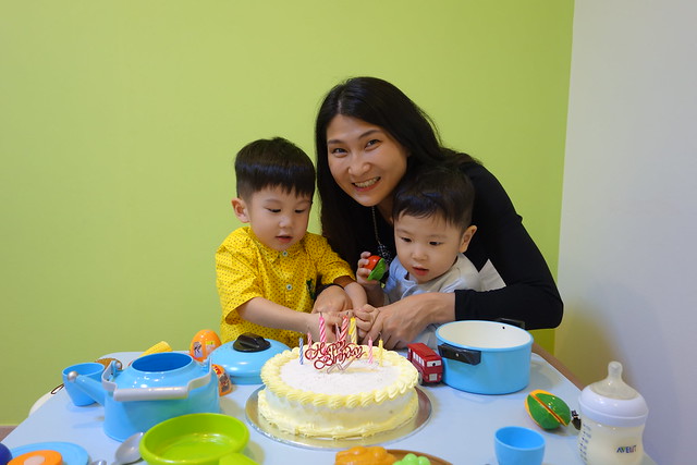 Cutting the birthday cake with both my sons. 