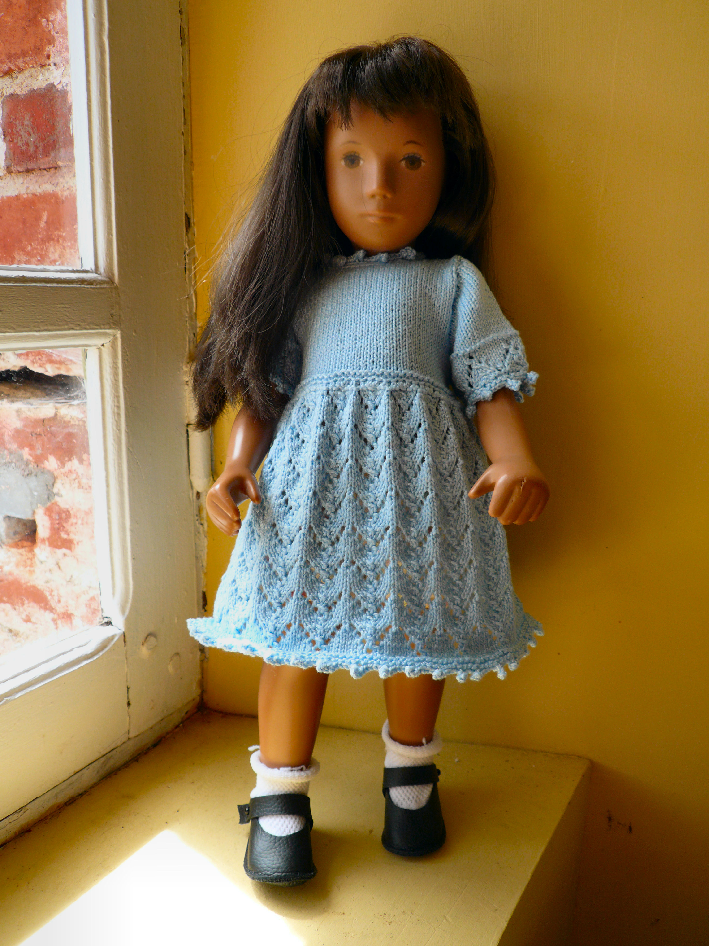 Blue dress on doll