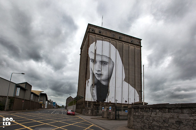 Artist Joe Caslin large scale paste-ups in Limerick, Ireland