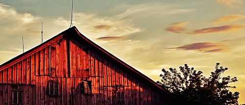 slow fade dusk evening sunset weathered window barn old decay sky clouds
