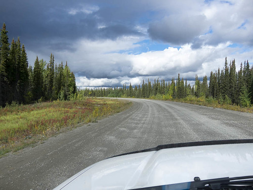 road travel canada car clouds forest roadtrip yukon hood curve forward gravel boreal northward yukonterritory campbellhighway yukonunorganized