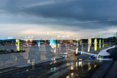 travel blue sunset reflection travelling yellow plane advertising iso800 switzerland evening airport zurich may selected f28 zurichairport dutyfree ch kloten 2014 0ev •••• ¹⁄₁₆₀secatf28 ef40mmf28stm