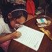 Homework while snacking.  #manangmana #growingupwithbea #schoolgirl