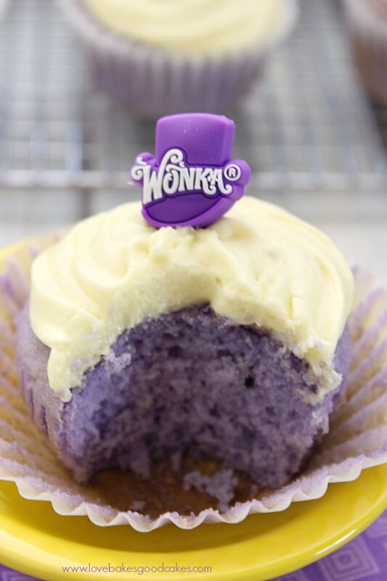 Grape Cupcake with Banana Icing close up with a bite removed.
