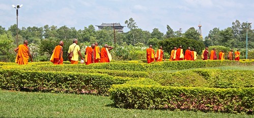 Buddhist monks exit the compound after the Chinese dignitary left