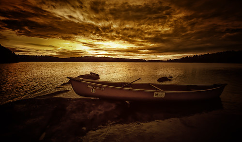 sunset ontario canada water clouds golden canoe silentlake