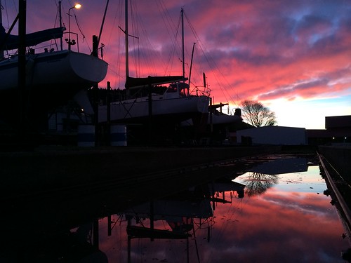 red sky reflection boats