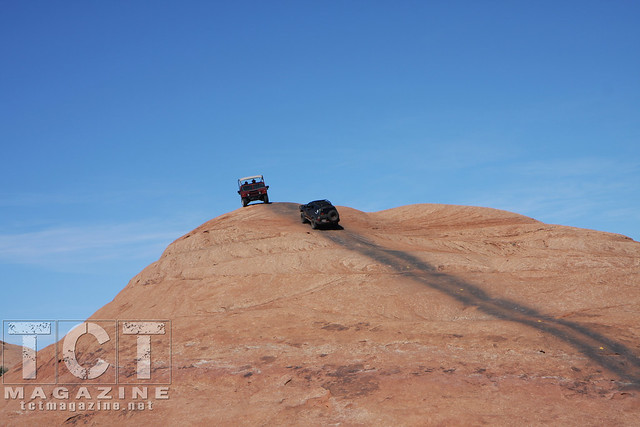 4Runners in Moab | A tourism Hummer serves as an obstacle atop Hell’s Revenge.