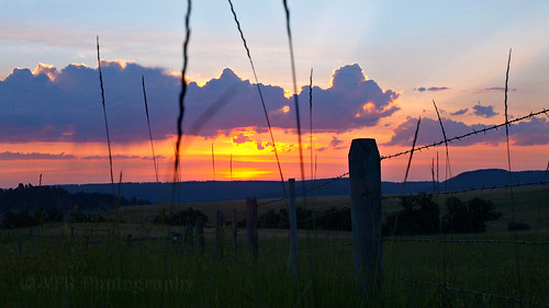morning cloud alva tourism nature grass silhouette clouds blackhills sunrise fence shower scenery ray glow natural scenic silhouettes fences western barbedwire fencing grasses rays wyoming showers barbwire predawn risingsun wy fenceline crookcounty prequel bearlodgemountains wy24 wyominghighway24