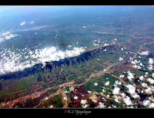 Bird's-eye view: Mountain-range as dam of clouds