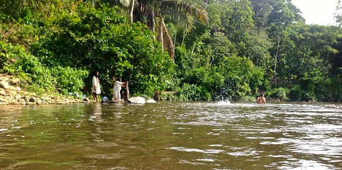 A local tribe baths in the river