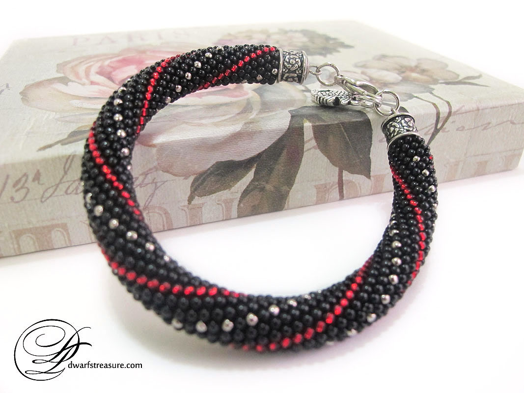 classy black bead bangle bracelet with geometric pattern