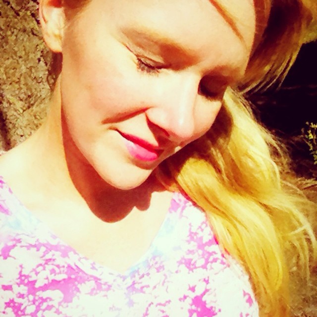 Squinting in the sunshine with fresh eyelash extensions.