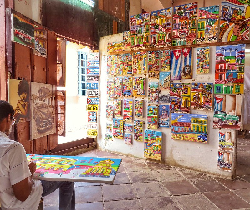 An artist paints in Trinidad, Cuba