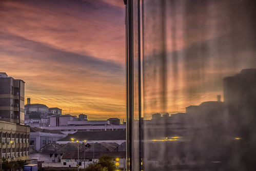 coimbra hotel window reflection university portugal sunrise colours