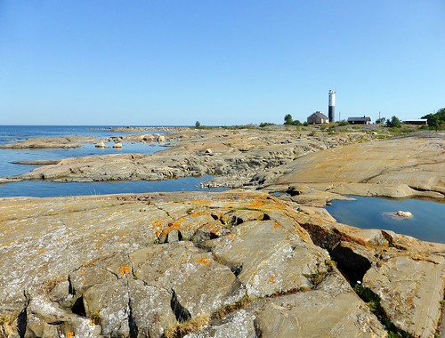 sea sky lighthouse rocks cliffs