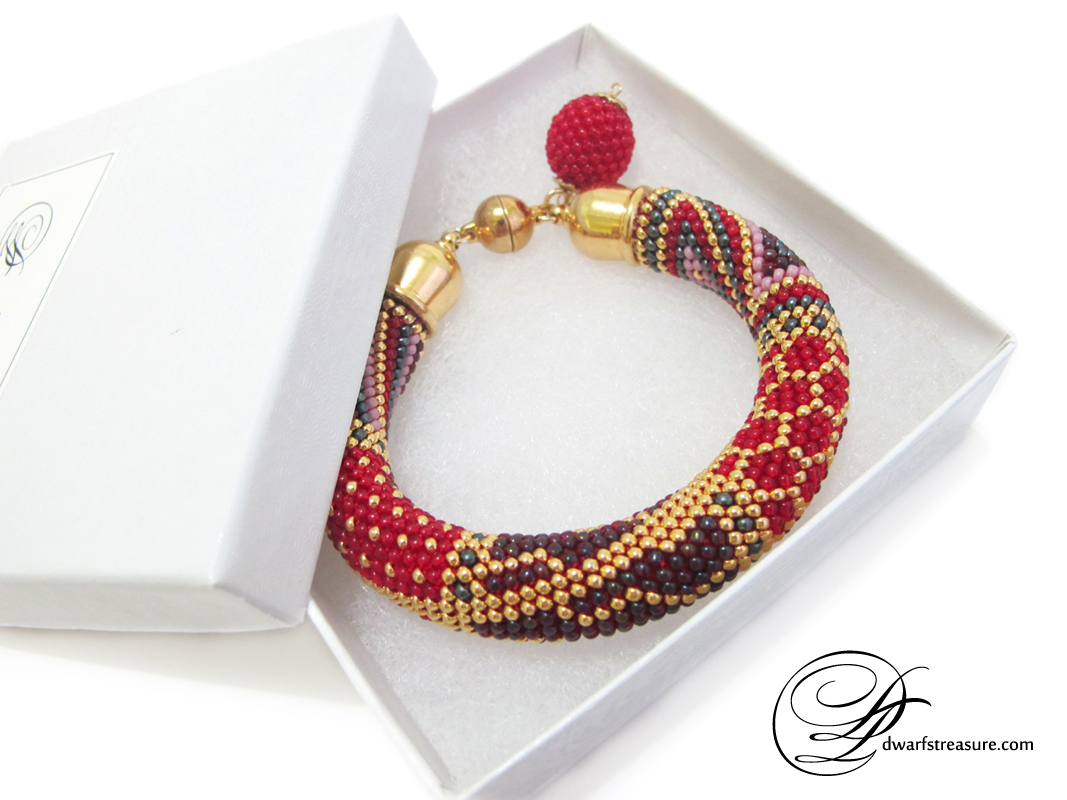 Supreme red crochet beadwork rope bracelet in the jewelry box
