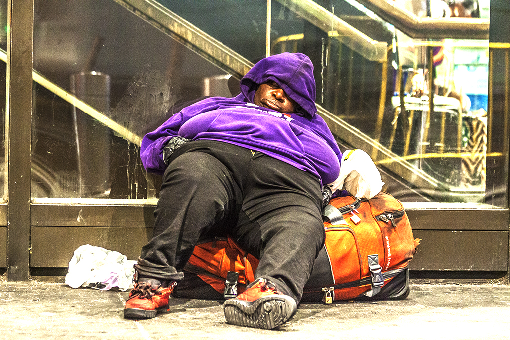 Man-sleeping-outside-Port-Authority-in-7-14--New-York