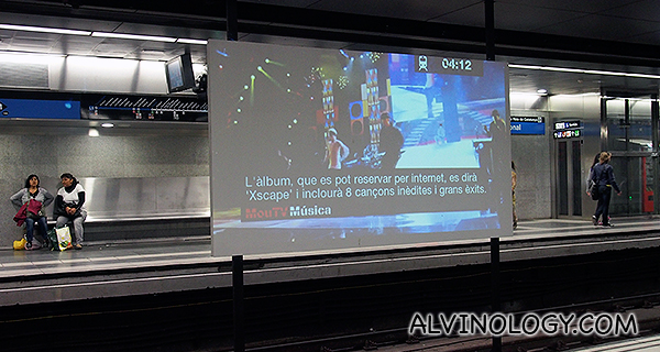 A projector screen for ads in the subway station