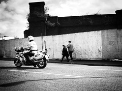 Police Motorbike and two people walking