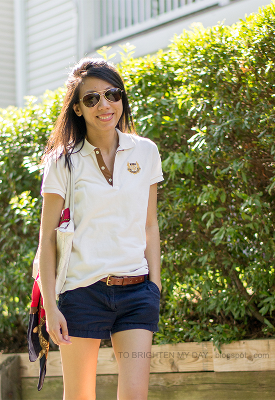 polo, navy shorts, chain scarf