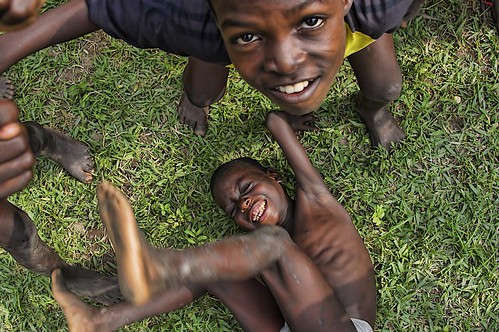africa boy playing boys play ghana westafrica roughhousing rollinginthegrass typicalboys ashaimbre