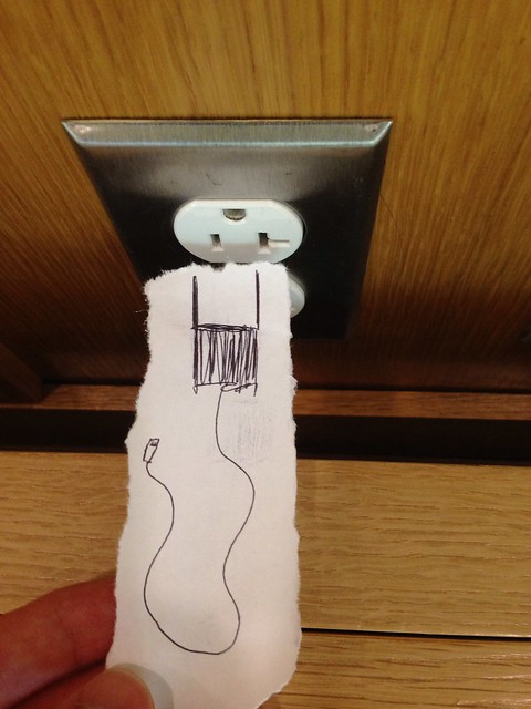 A paper "plug" and an electrical socket!