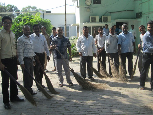 Dr Nafees Ansari, Director, Center for Distance Education participating in the Cleanliness Drive at the Center.