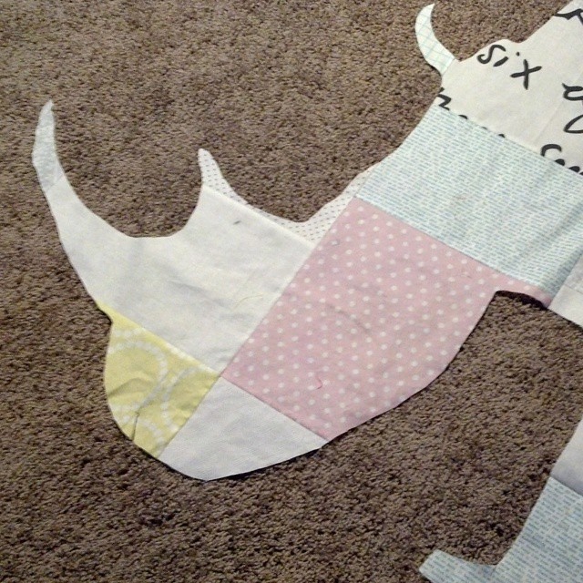 Cut out the background from behind the big rhino applique. #rhinoquilt Time to baste.