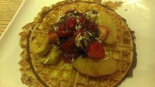 Waffle with caramelised banana and walnut froyo, poached pears, strawberries, caramelised bananas, coconut, nutella sauce and raspberry sauce at Frolic Frozen Yoghurt