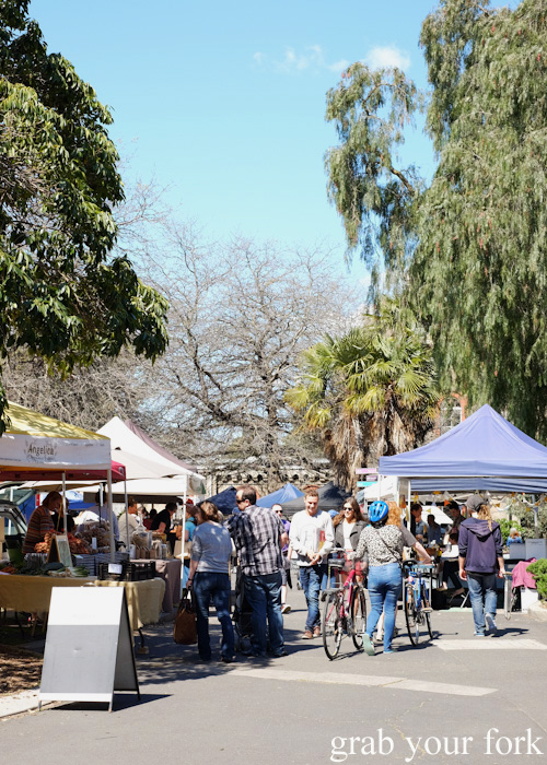 Shoppers and stalls at Abbotsford Convent Slow Food Farmers Market